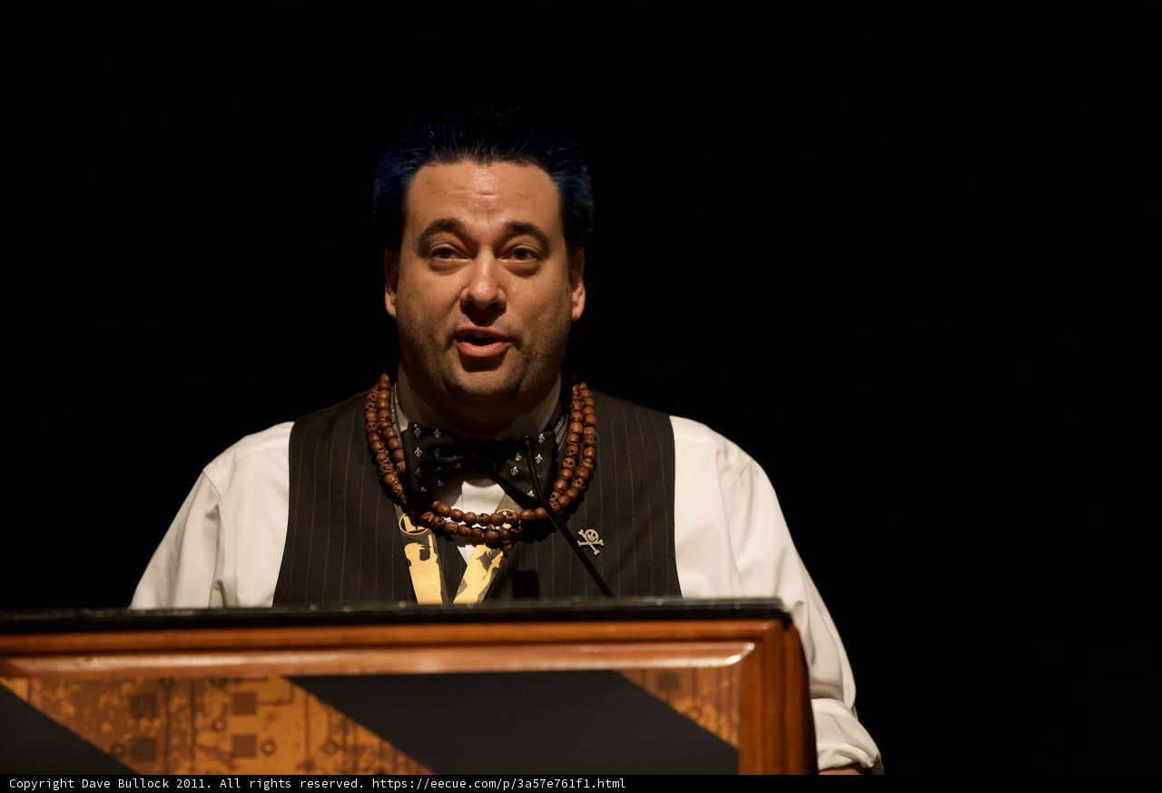 Blue-Haired Man at the Podium