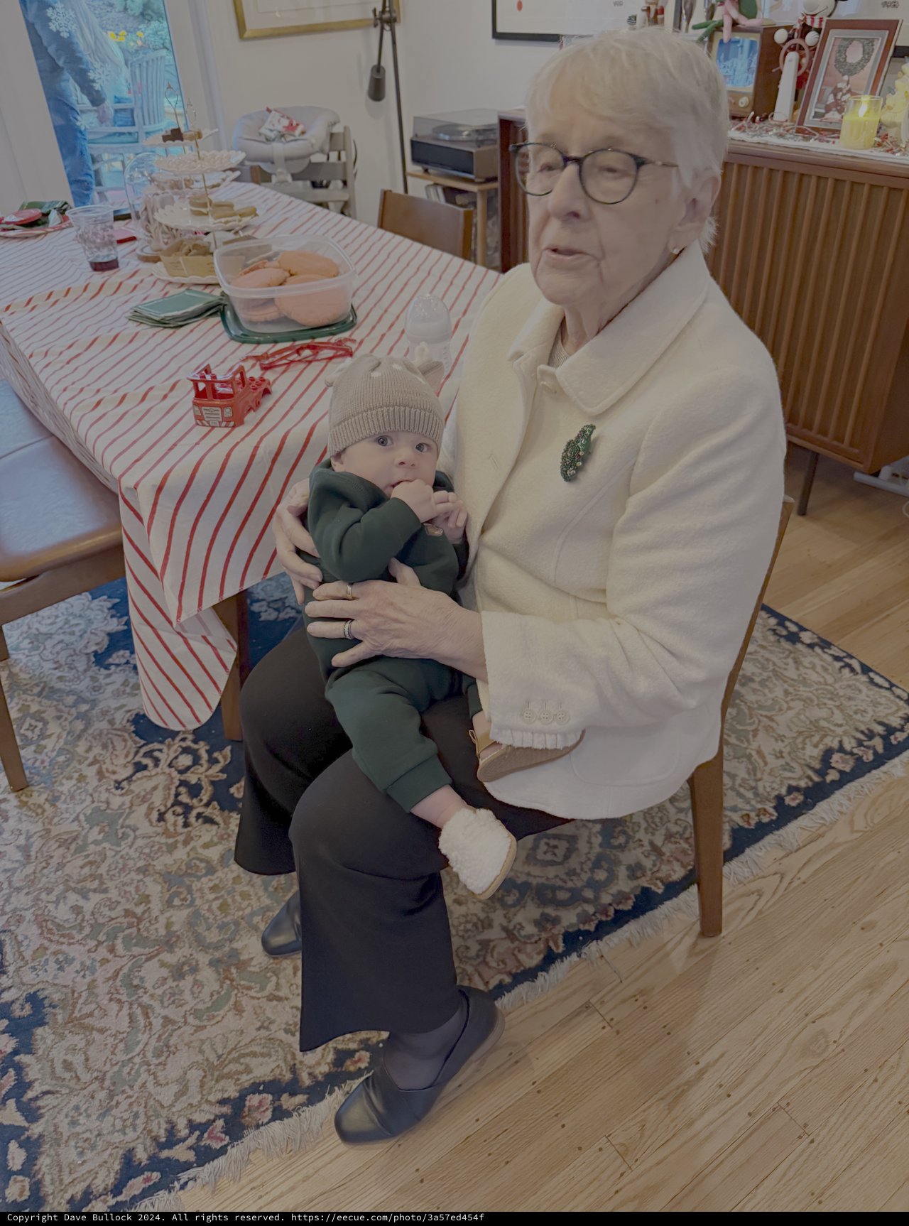 Grandmother Holding Baby in Cozy Living Room