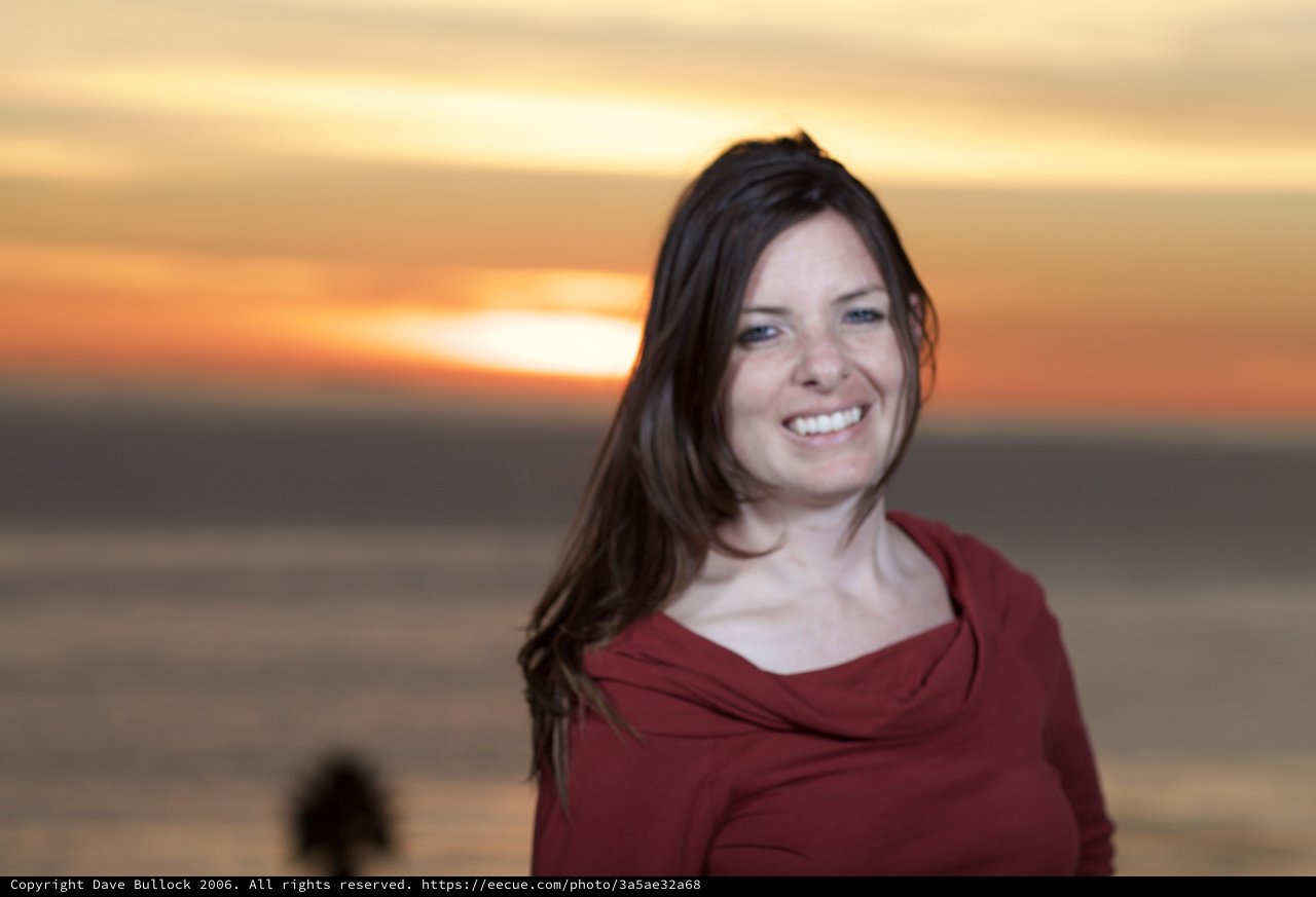 Radiant Smile at Golden Hour by the Sea