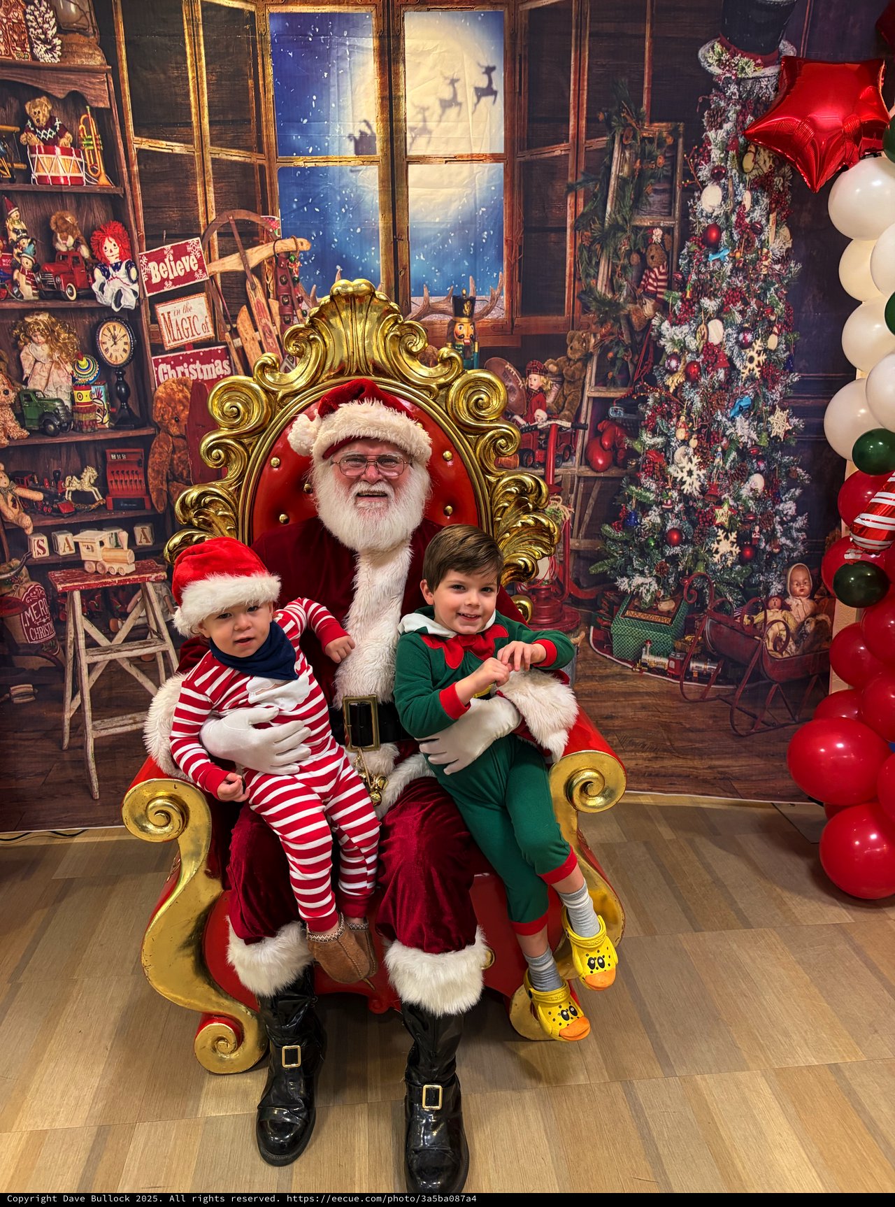 Santa's Workshop Visit with Two Happy Children