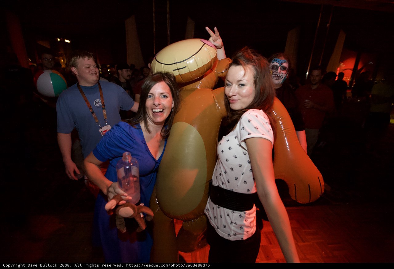Friends Pose with Inflatable Scooby-Doo at Party