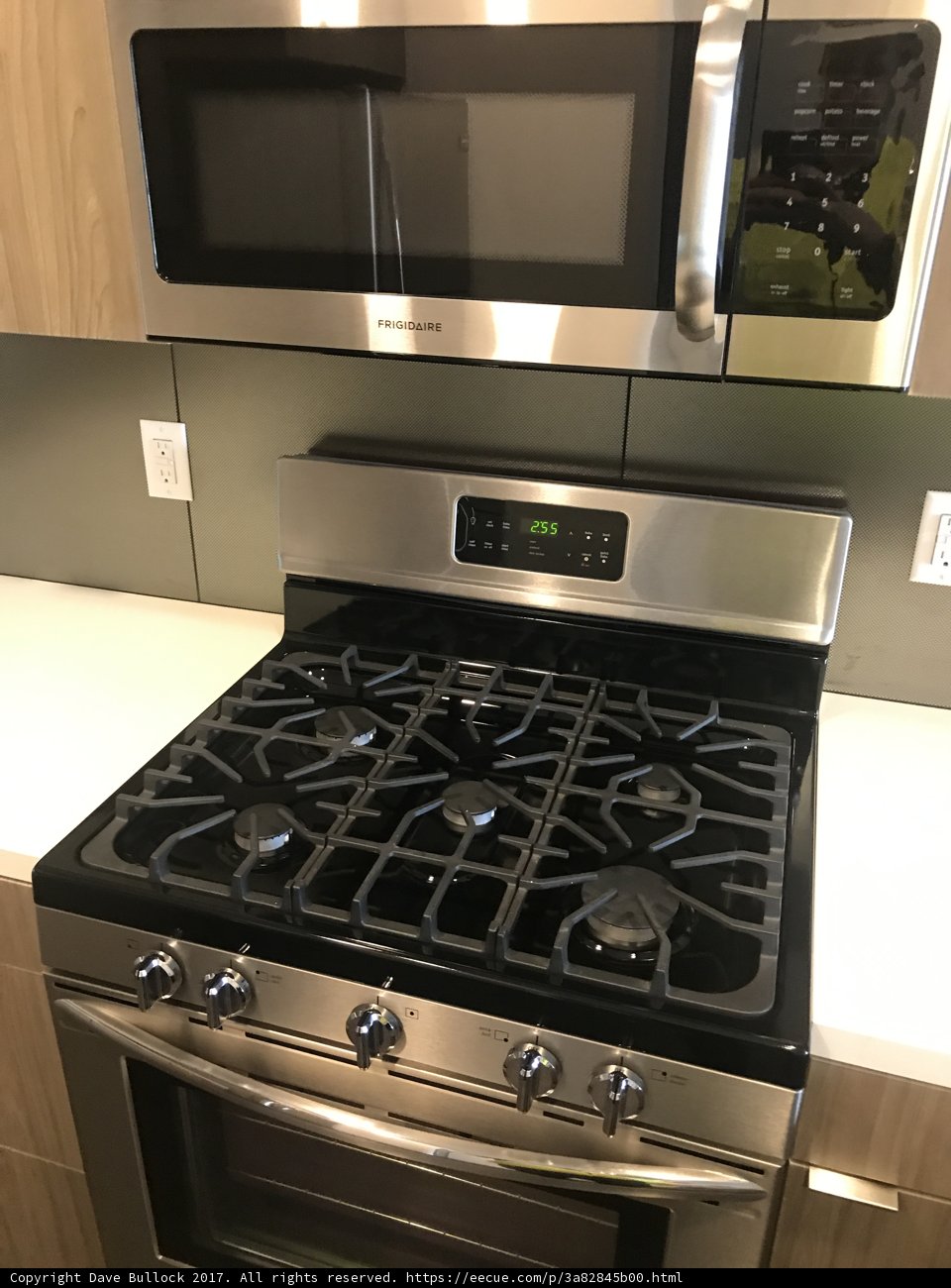Sleek Stainless Steel Stove and Microwave Set