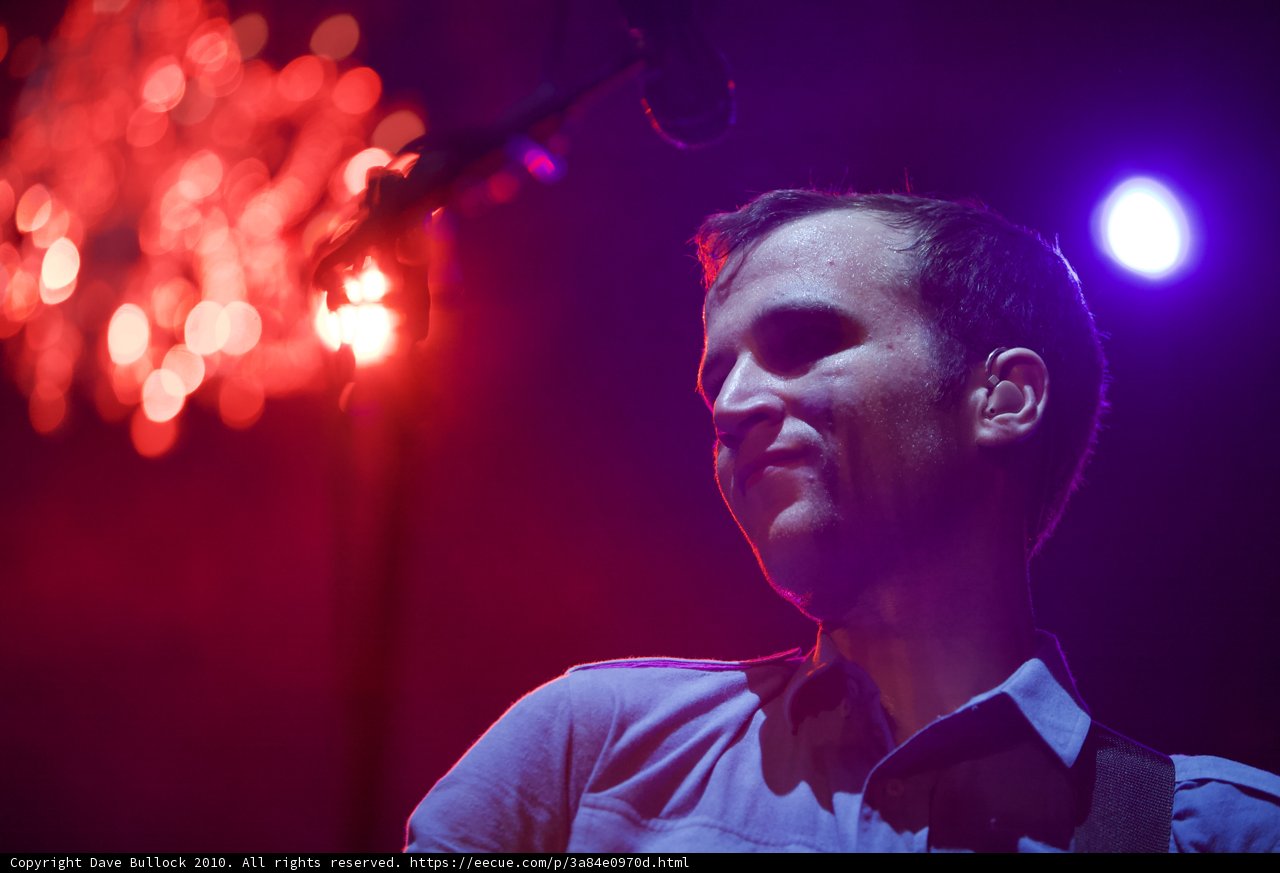 The Spotlight on the Blue Shirted Guitarist