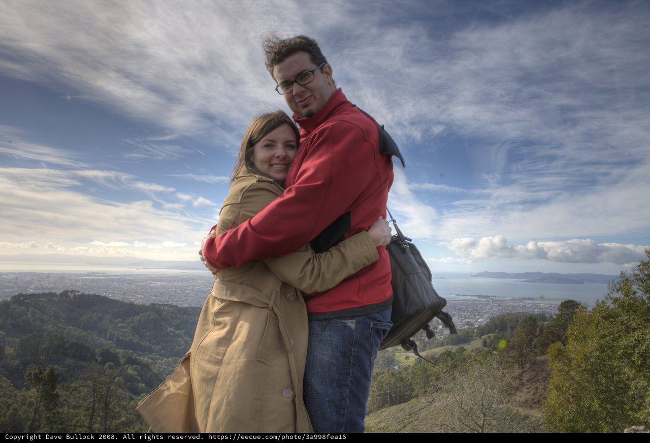 Couple Embracing Atop Berkeley Hills Overlooking San Francisco Bay