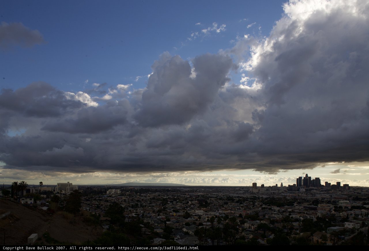 Cityscape under a Blanket of Cumulus Clouds
