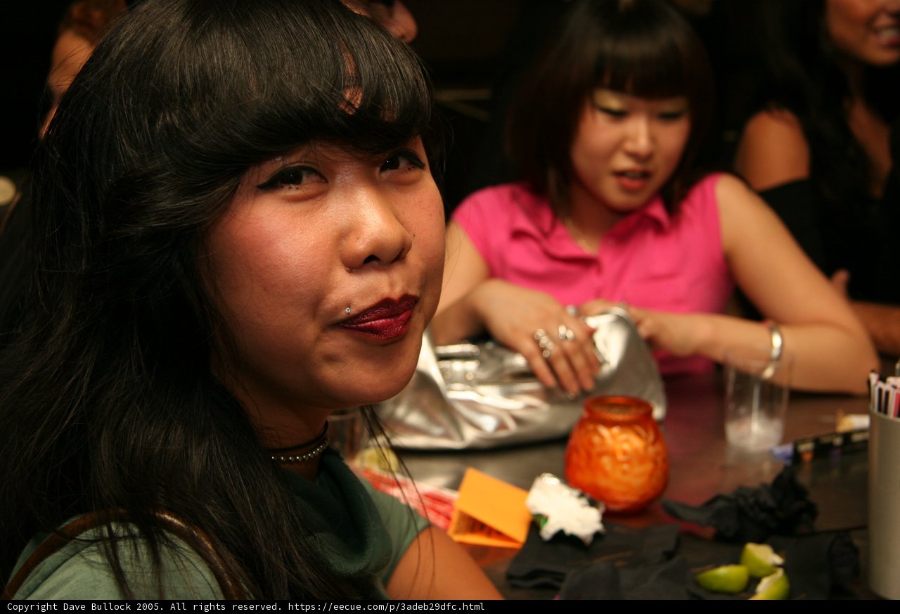 Long-Haired Lady Sips on Grapefruit Juice at Downtown Eatery