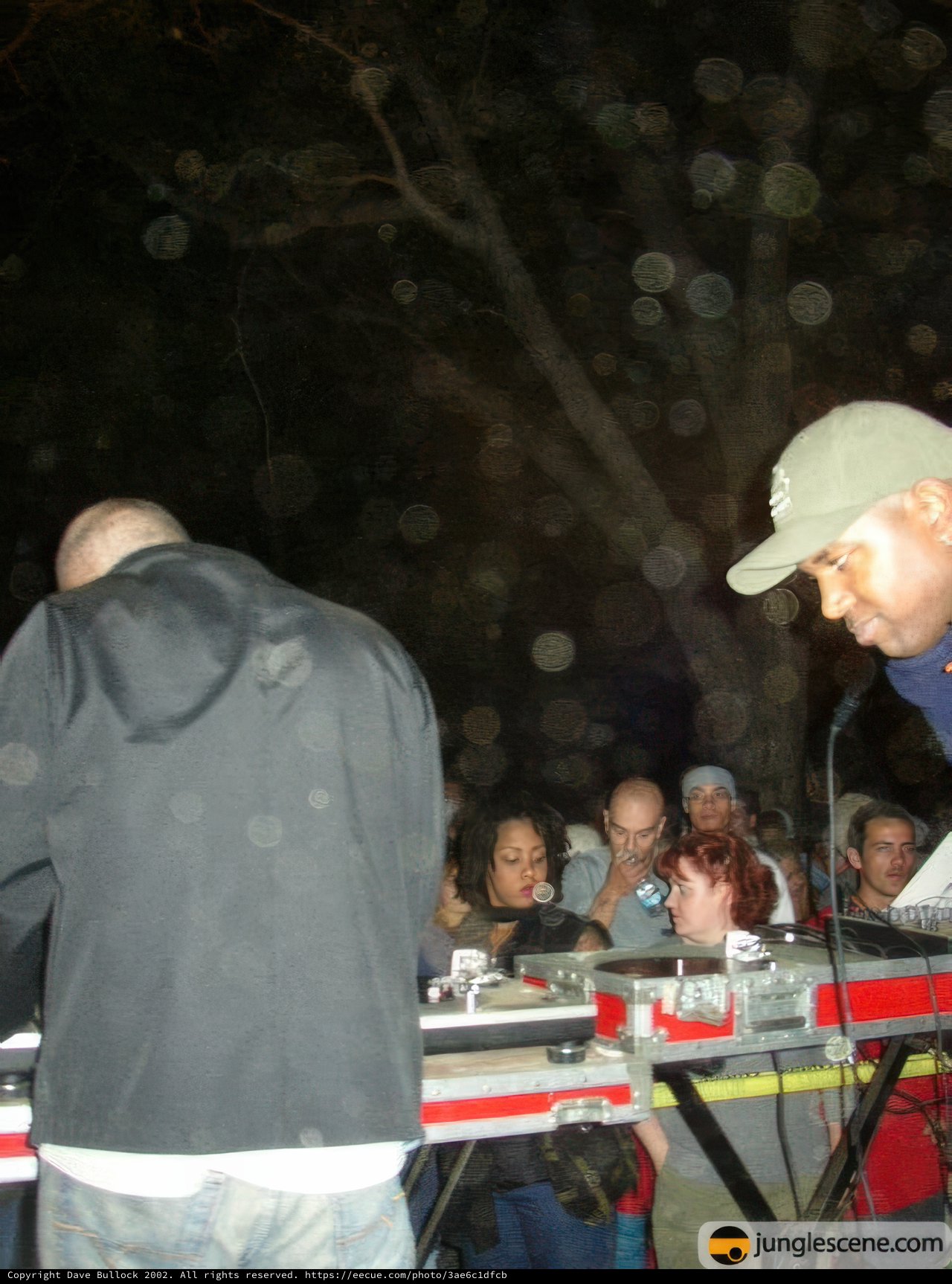 Two Men Entertain the Crowd with Music at Outdoor Event