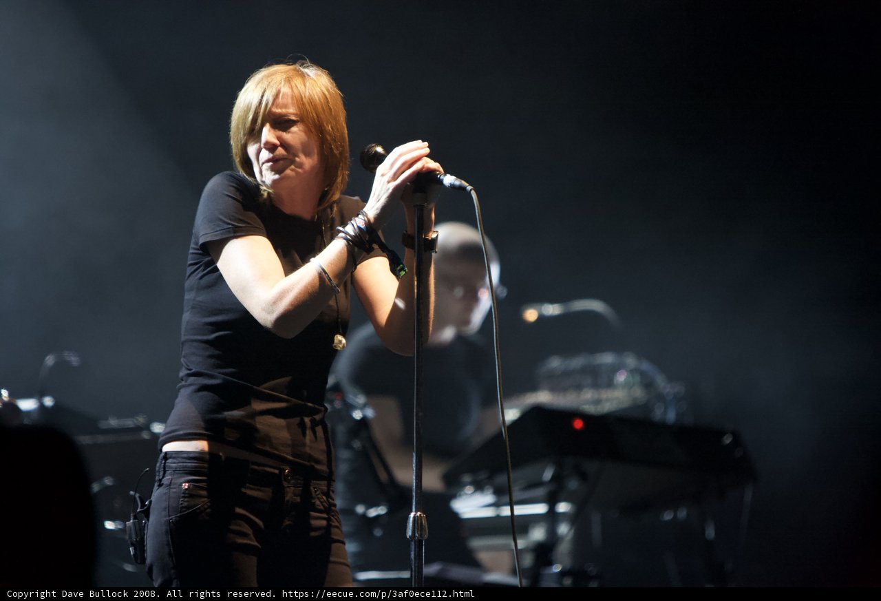 Woman in Black Shirt Sings her Heart Out on Stage
