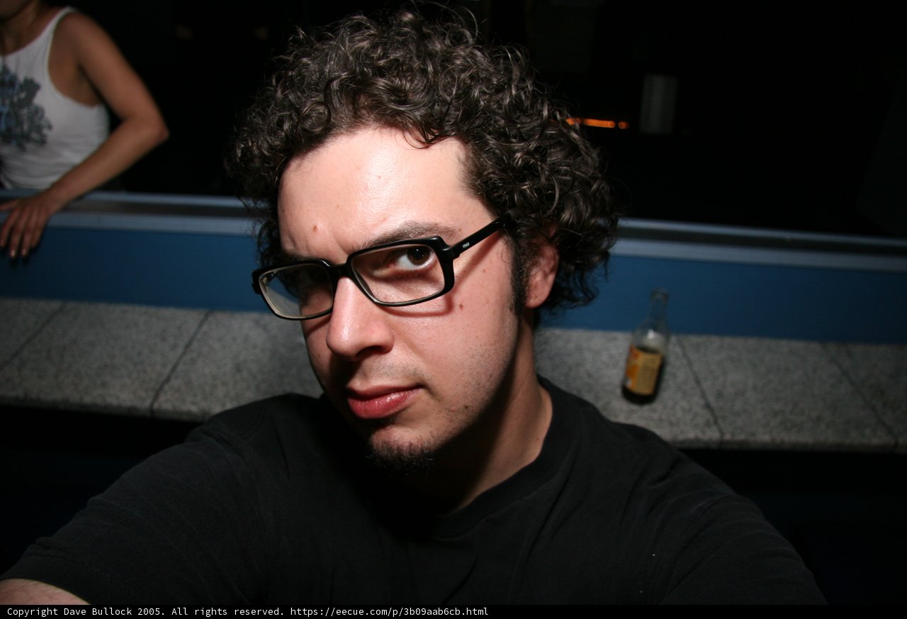 Portrait of Dave B wearing glasses
