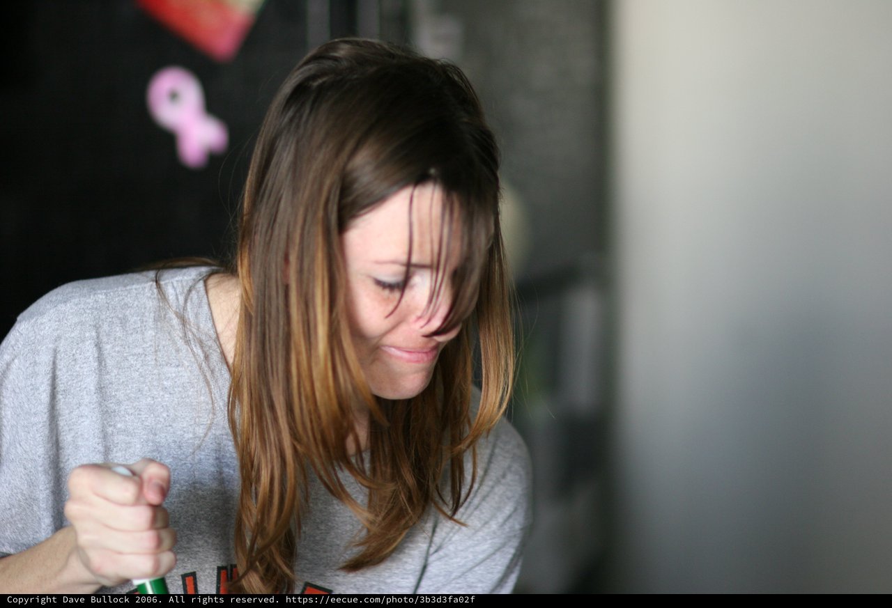 Young Woman Looking Down in Contemplative Moment