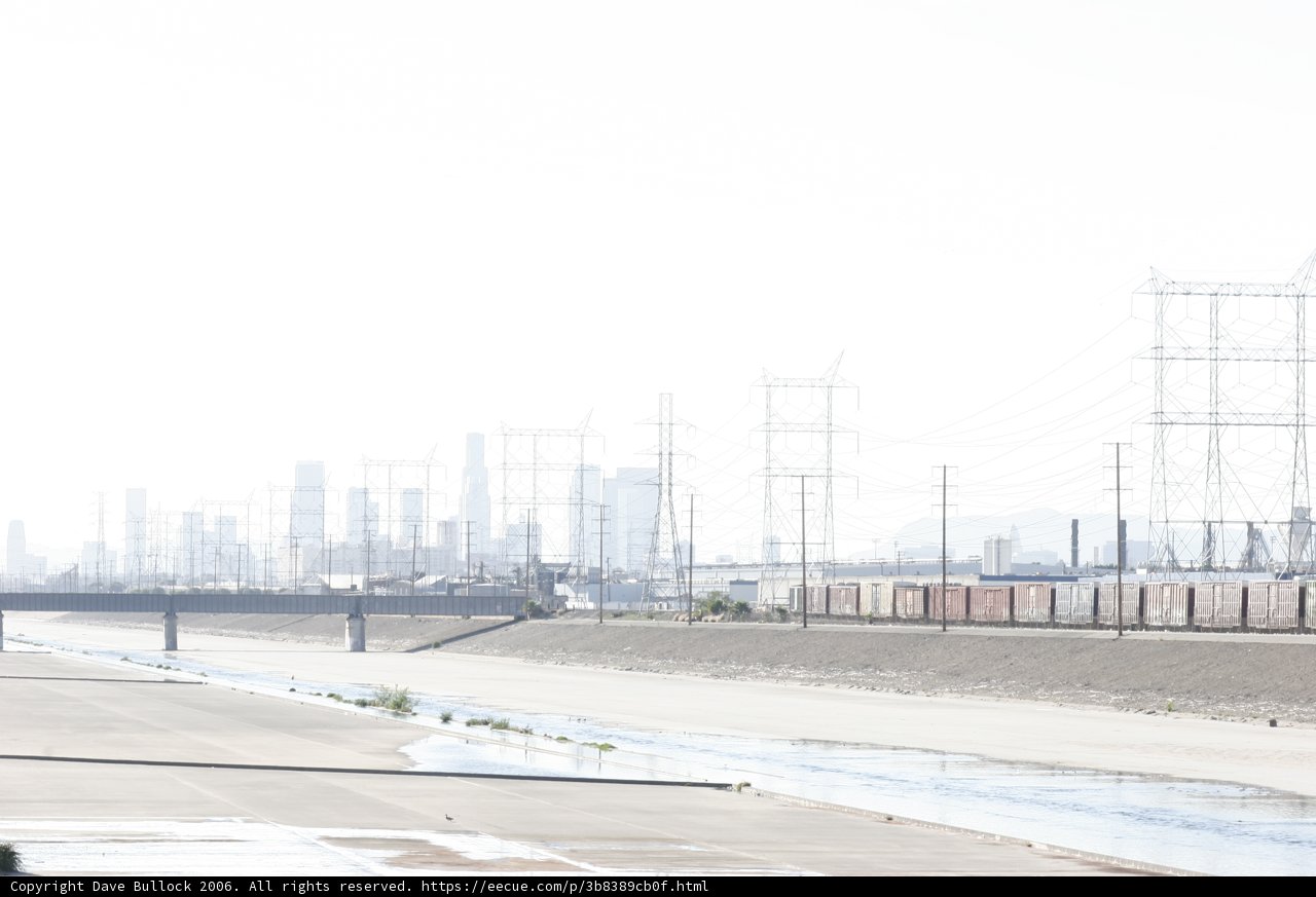 Parked Train Amid Urban Infrastructure