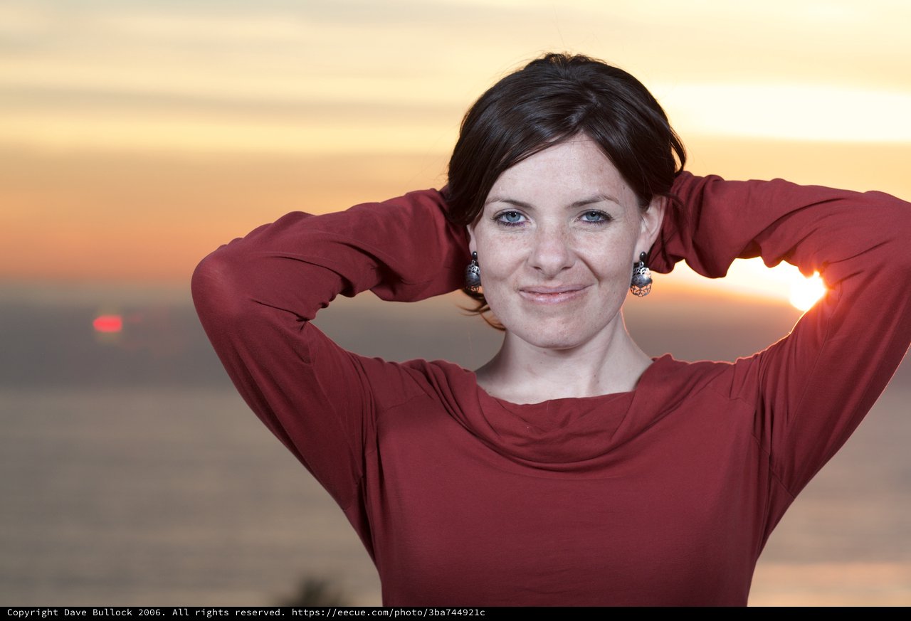 Woman in Red at Golden Sunset by the Sea