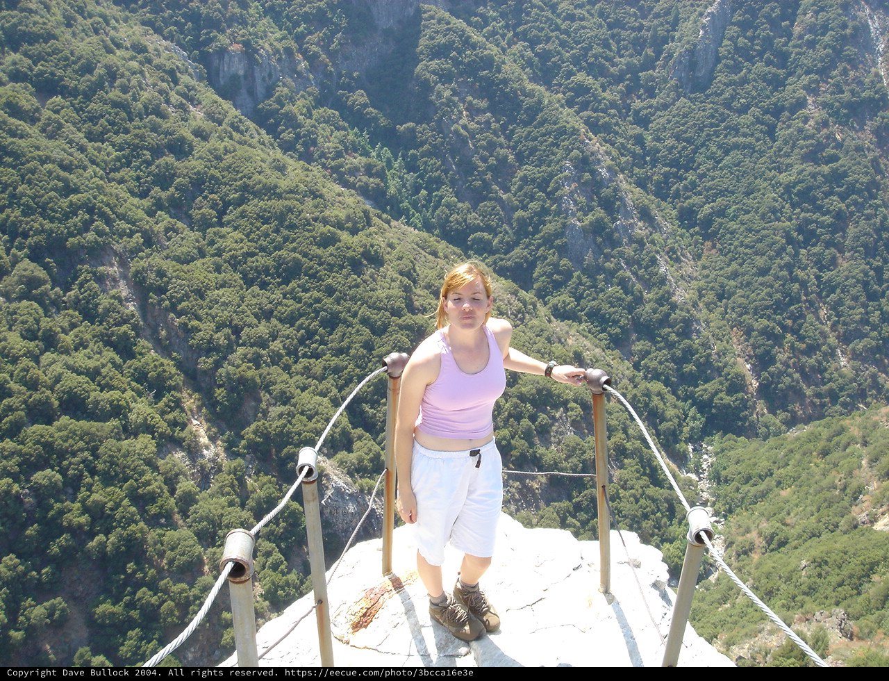Fearless Woman Stands at Mountain Viewpoint Edge