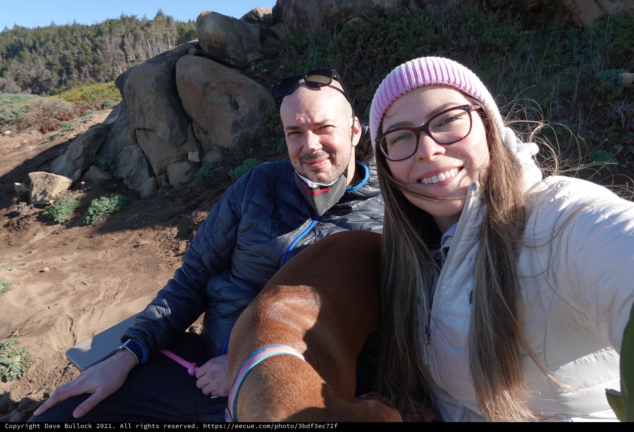 Couple's Selfie with Dog on Rocky Coast