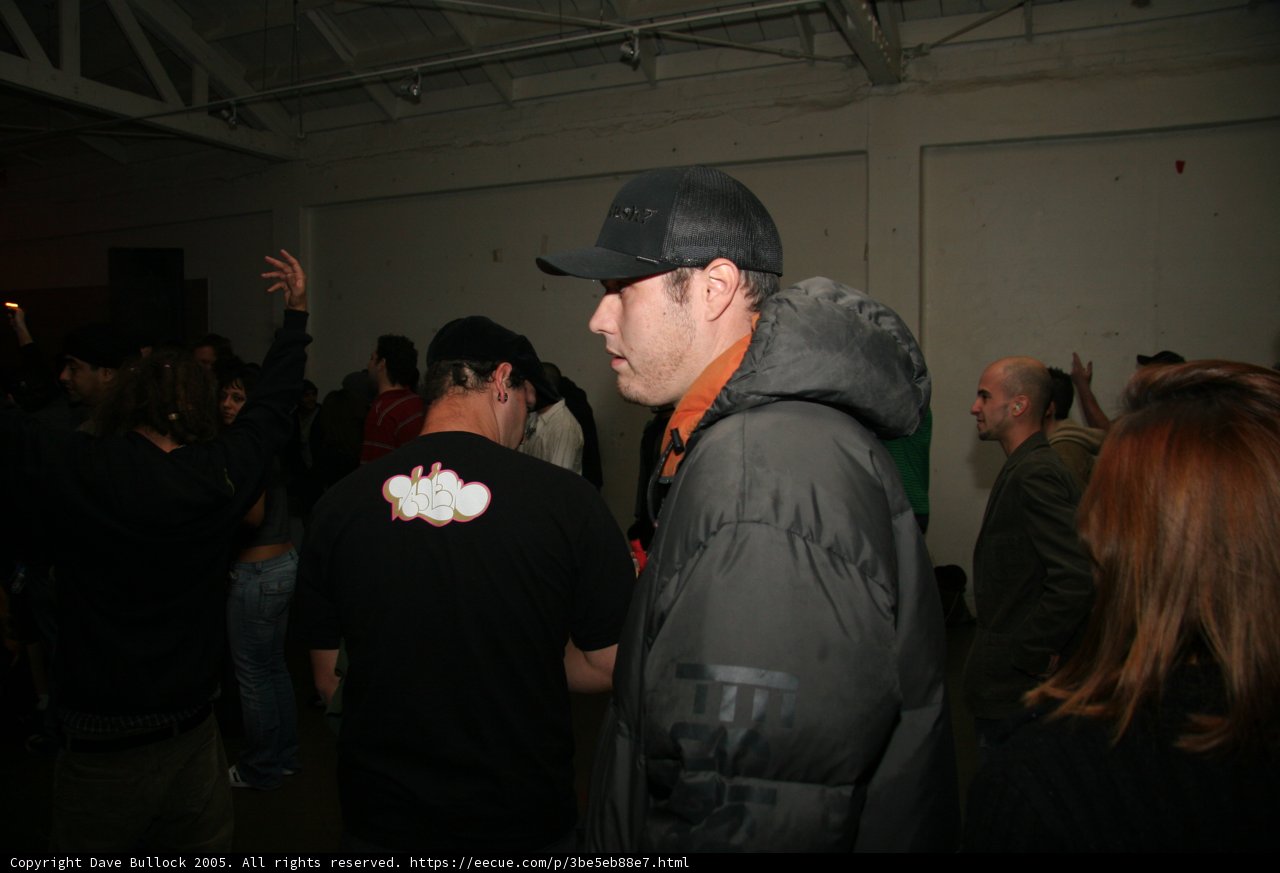 Man in Black Jacket Surrounded by a Crowd