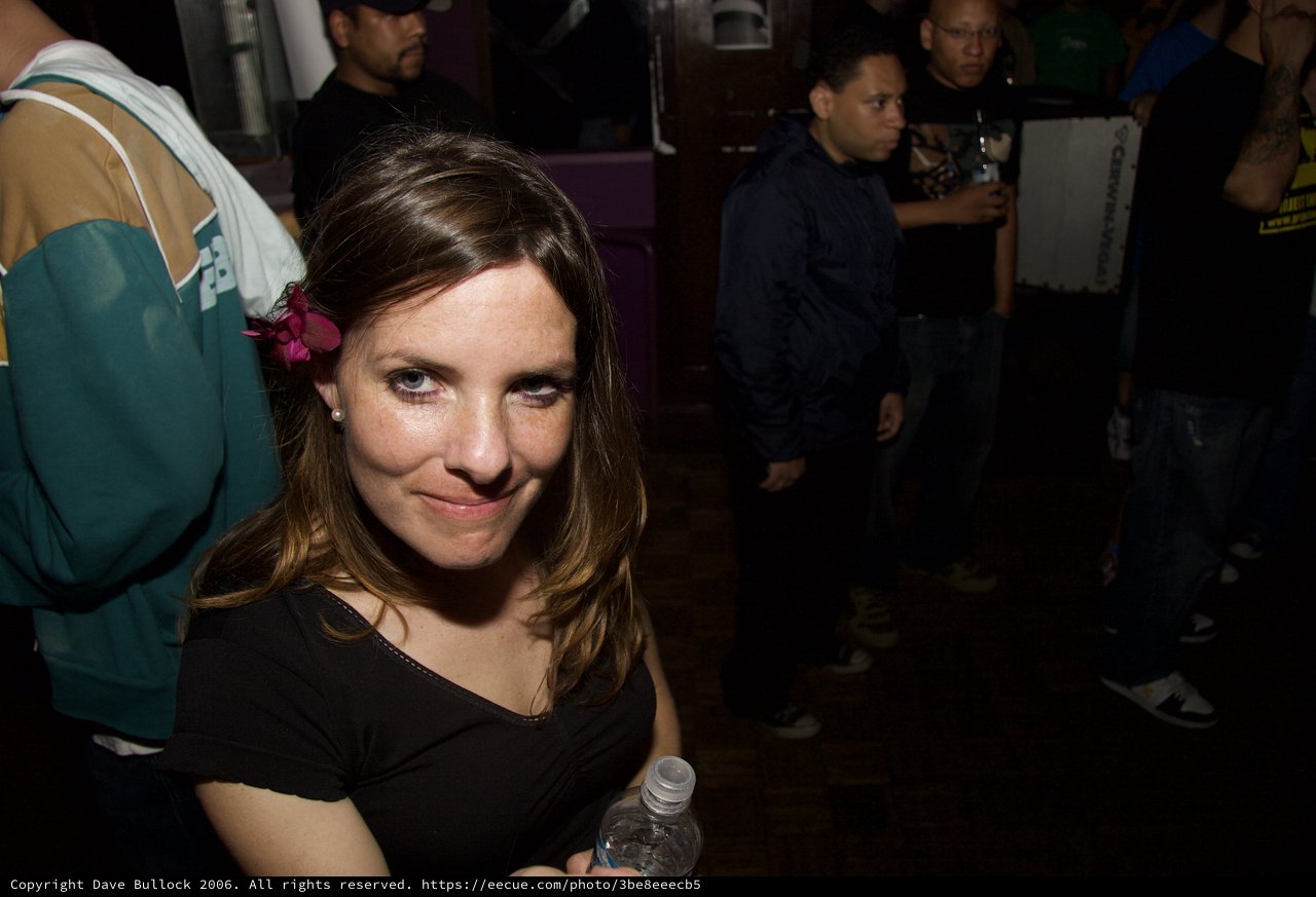 Woman with Pink Flower at Nightclub Party 2006