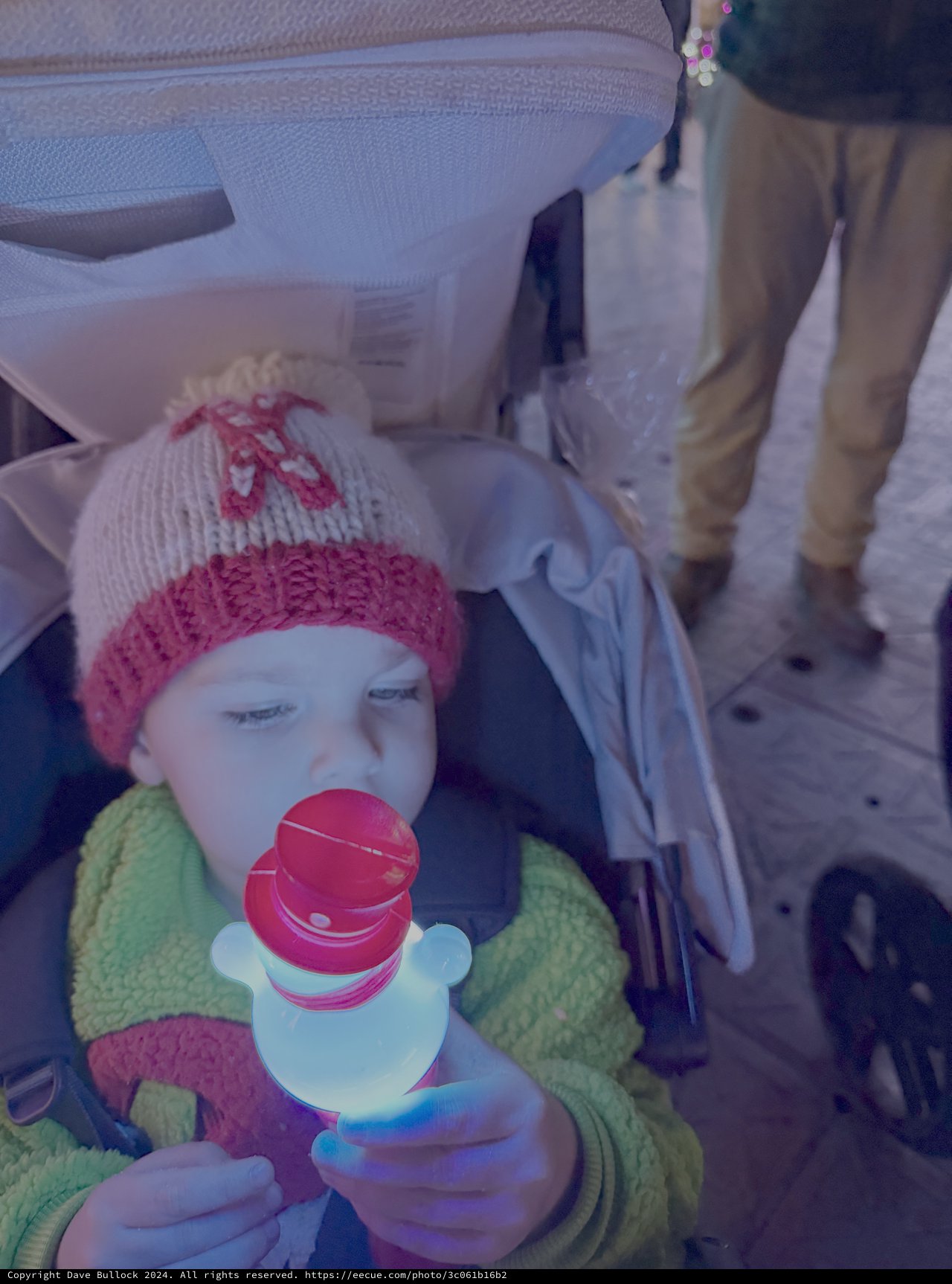 Baby in Winter Hat Drinking from Sippy Cup