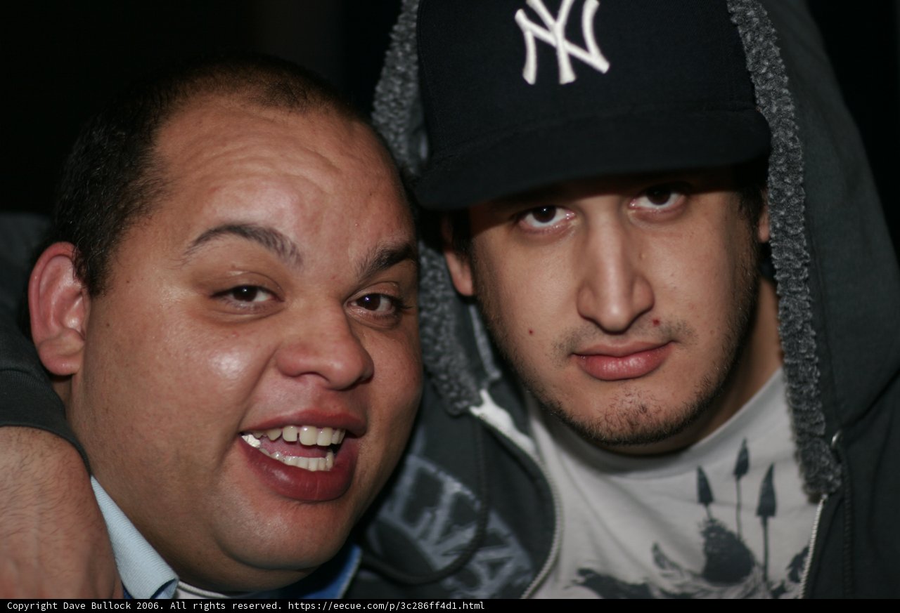 Two Men in Baseball Caps
