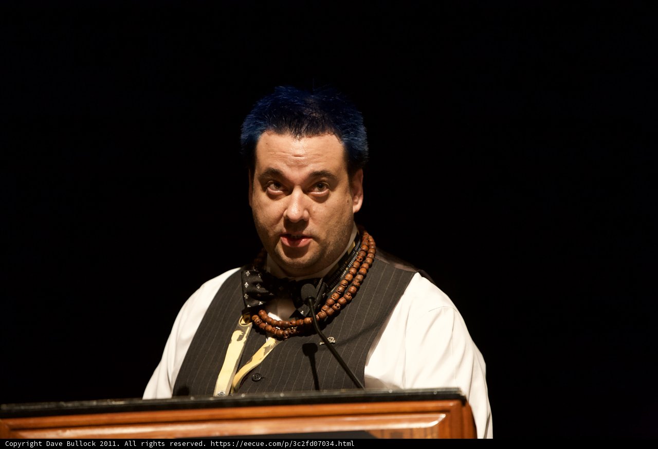 Blue-haired Man Takes the Podium