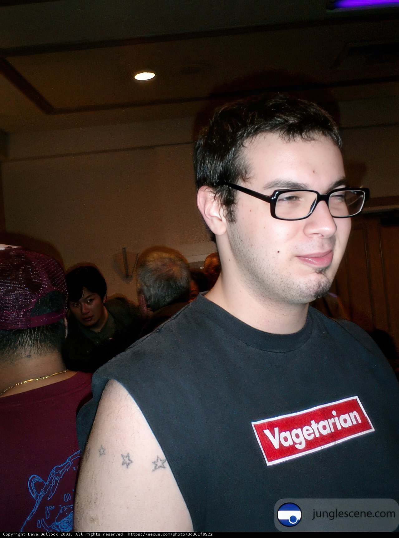 Tattooed Man in Glasses and Cap