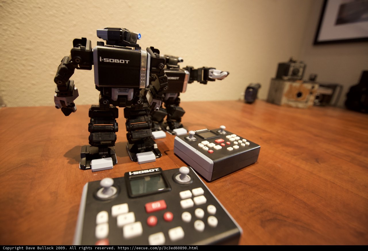Playful Toy Robots Share a Wooden Table