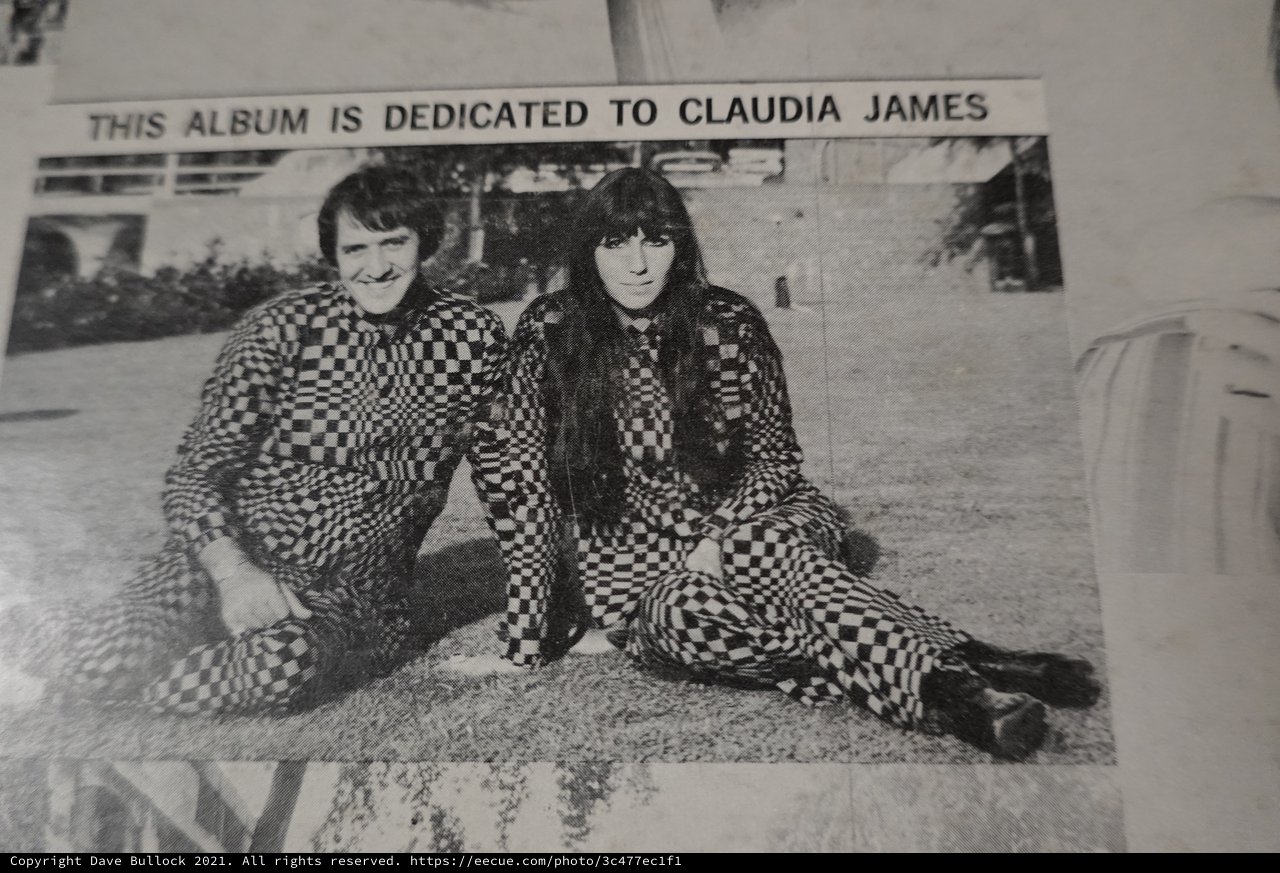 Duo in Matching Checkered Outfits Album Dedication