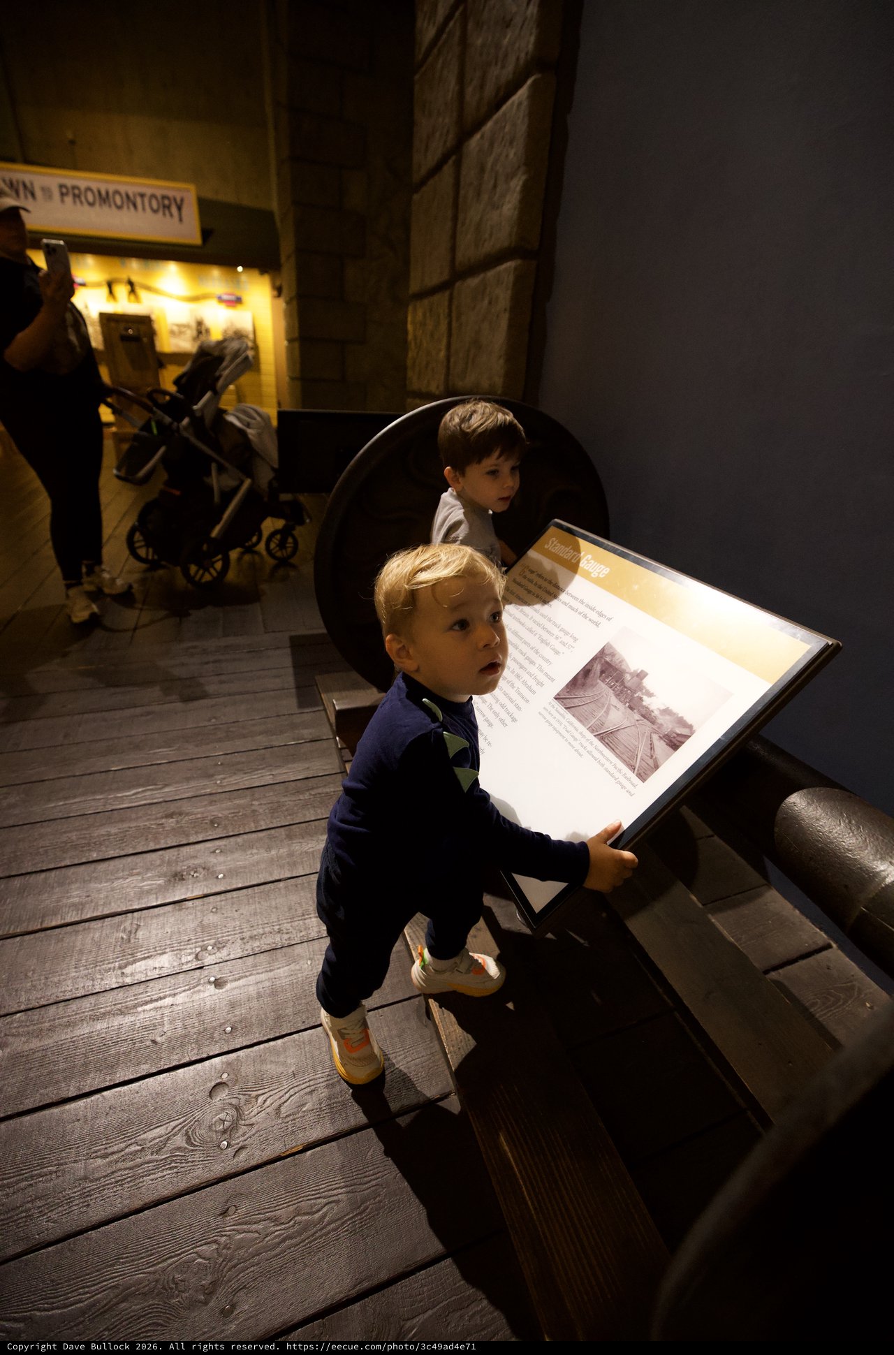 Young Boy Engaged in Museum Learning Experience