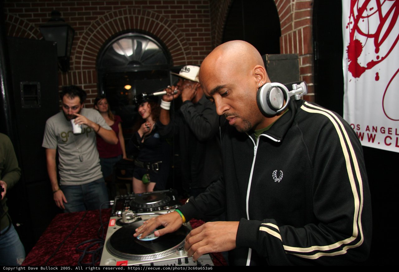 DJ Spinning Vinyl at Late Night Club Event