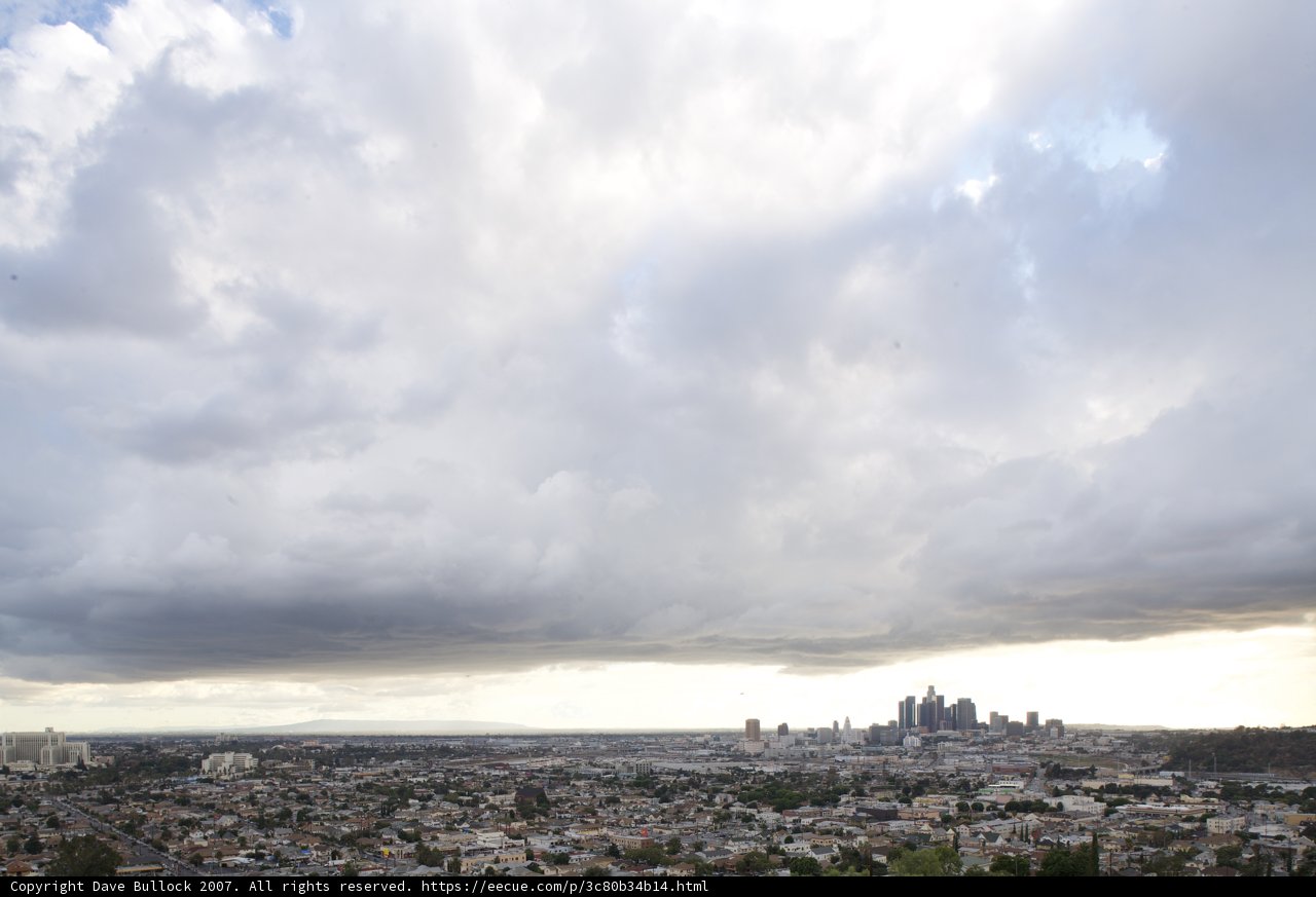 A Glimpse of the Metropolis Under a Cloudy Sky