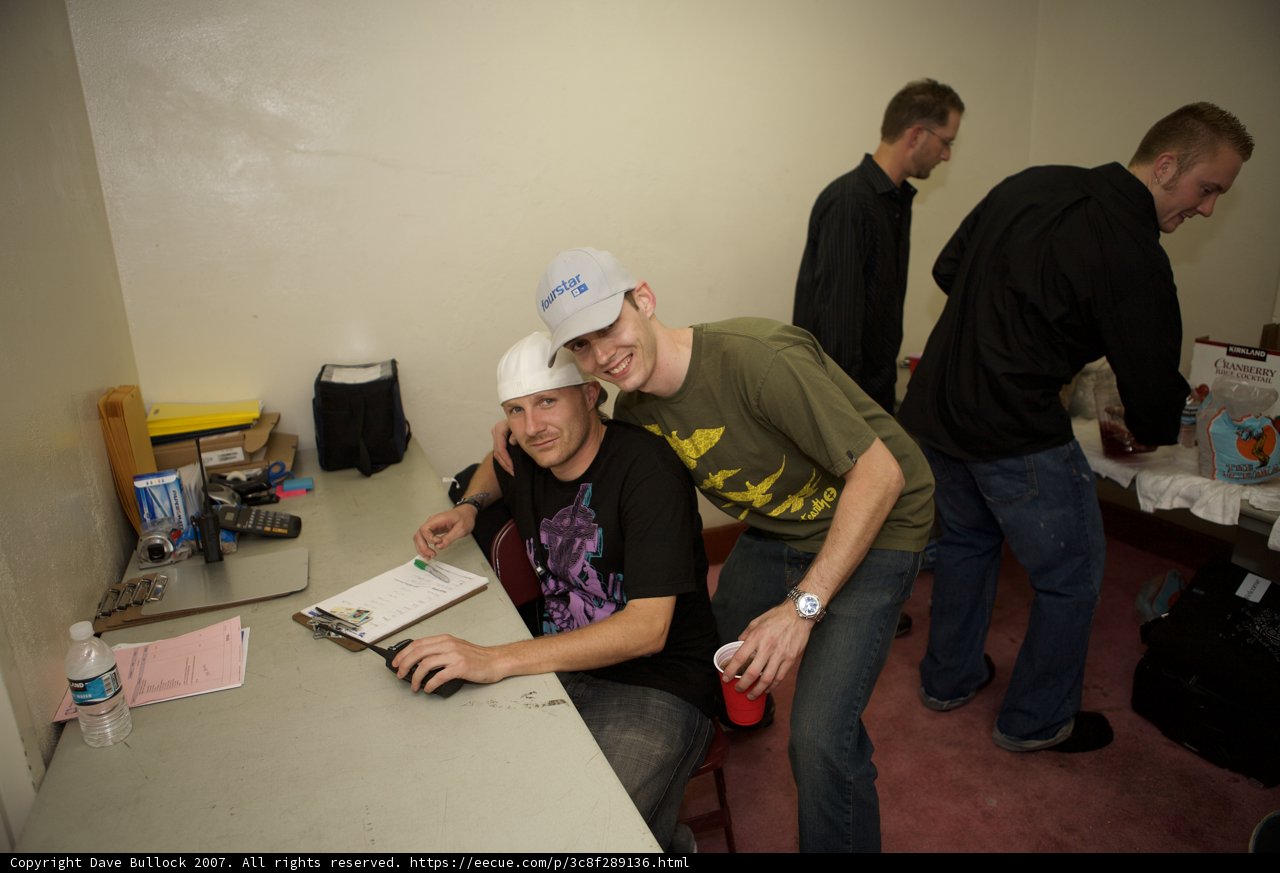 Two Men Discussing Plans at a Table