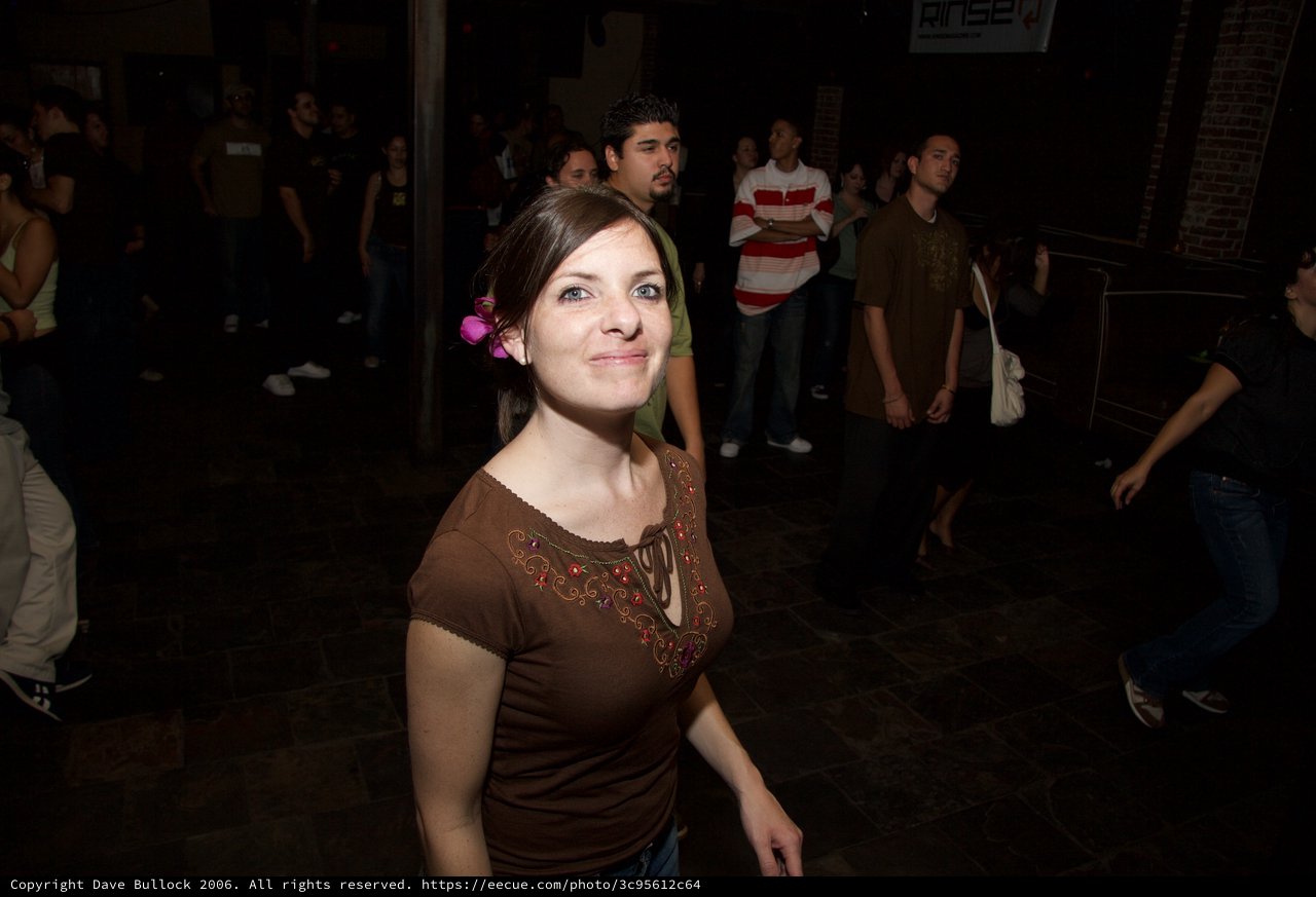 Young Woman Smiling at Night Outdoor Art Walk