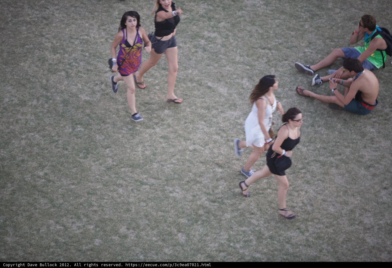 Three Friends Enjoy a Relaxing Stroll at Coachella Festival