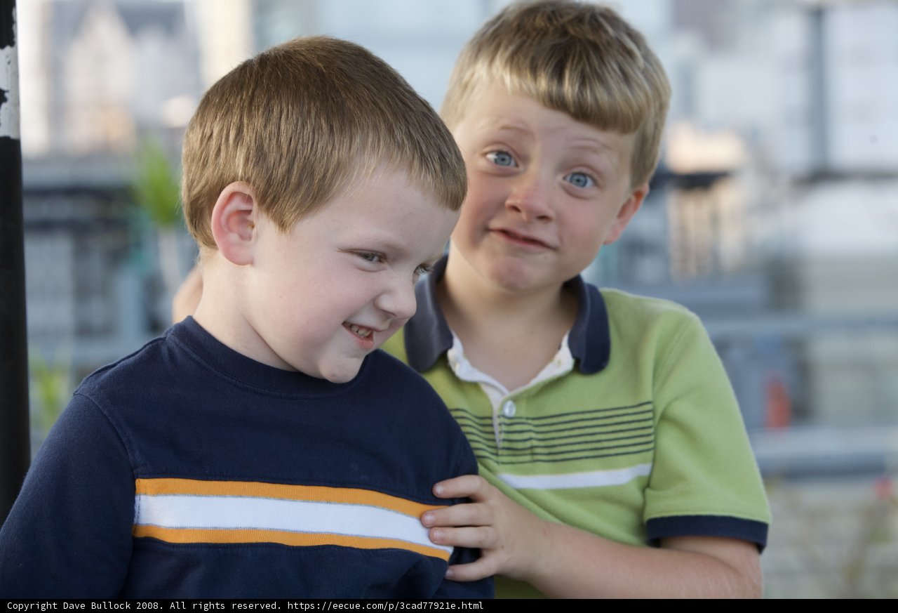 Two happy boys pose for the camera