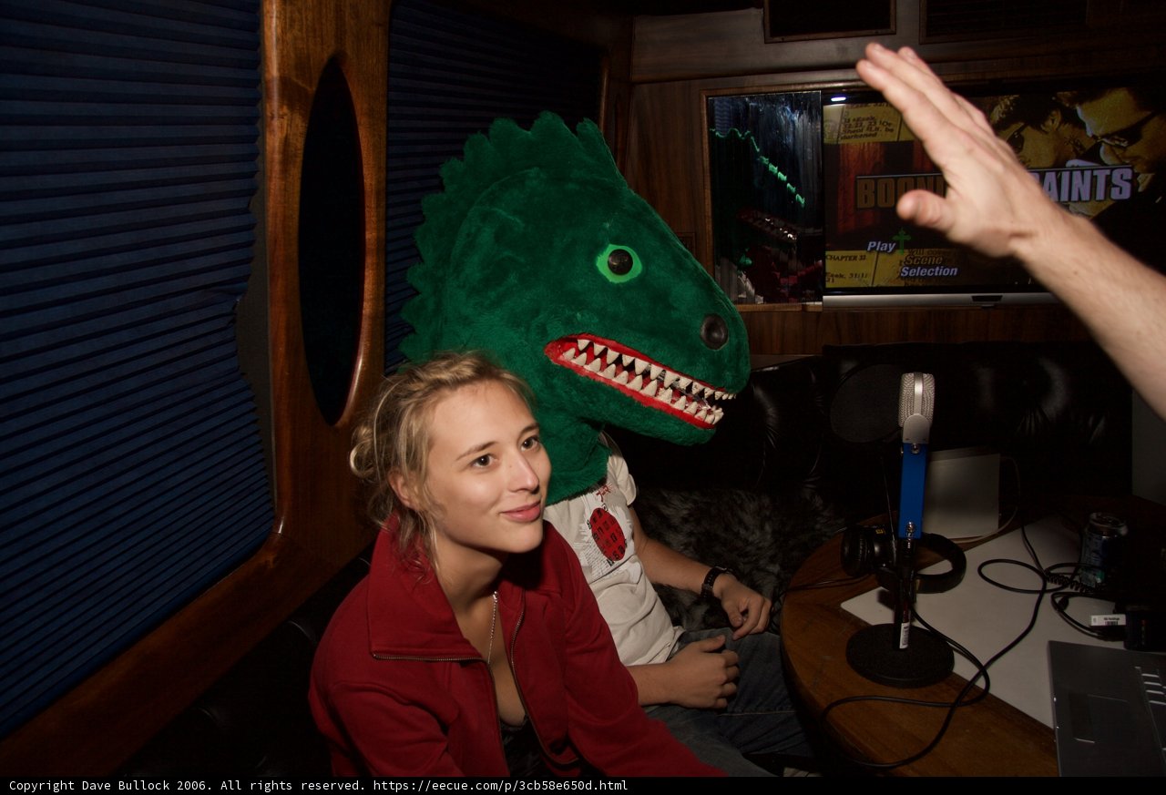 Dinosaur Mascot and Man in Chair
