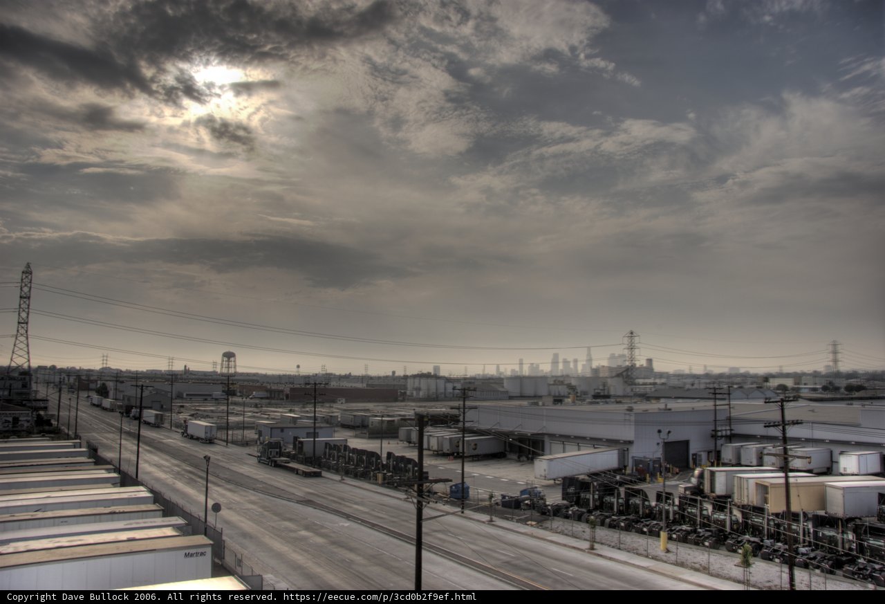 Sun Breaks Through Cloudy Cityscape