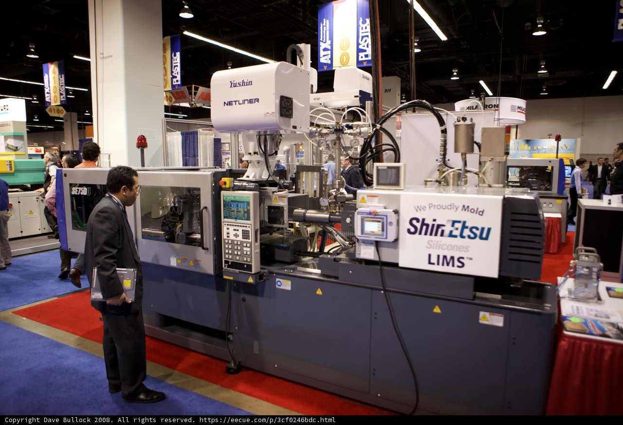Man Operating Machine in Factory