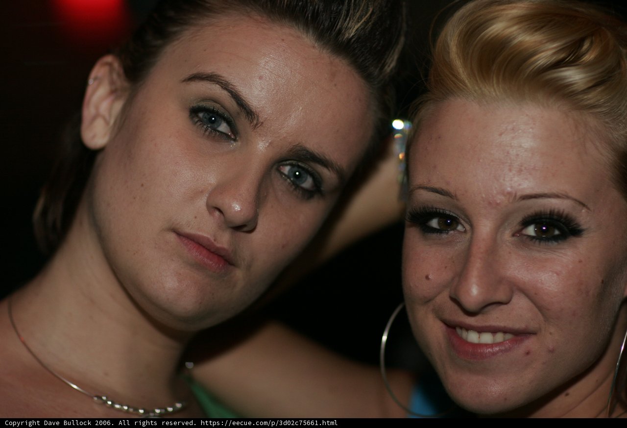 Two Women Strike a Pose in the City
