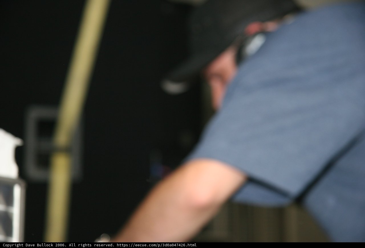 Man in Blue Shirt and Hat