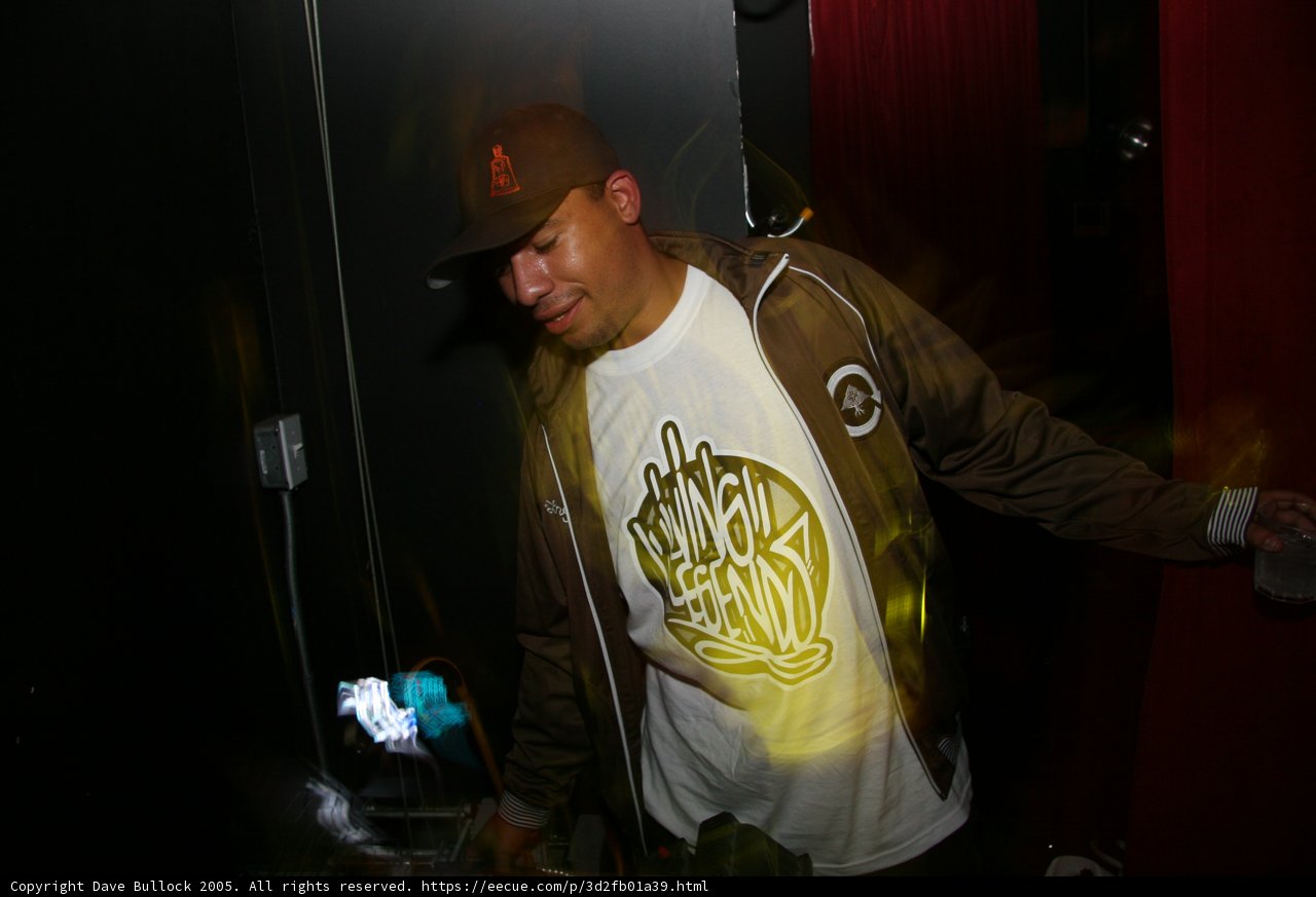 Brown Jacketed Man with Baseball Cap