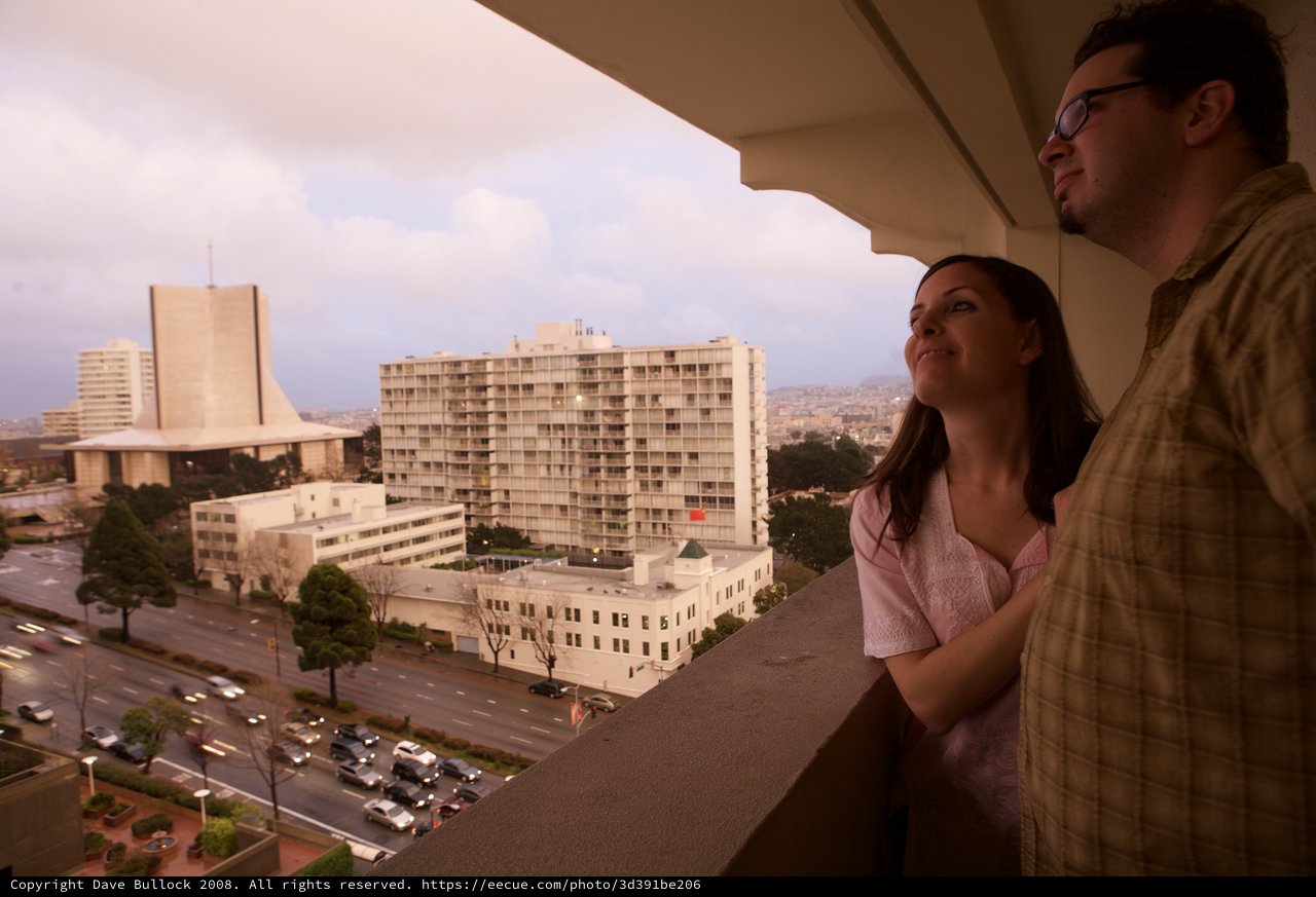 Couple Gazing Over San Francisco from Hotel Balcony