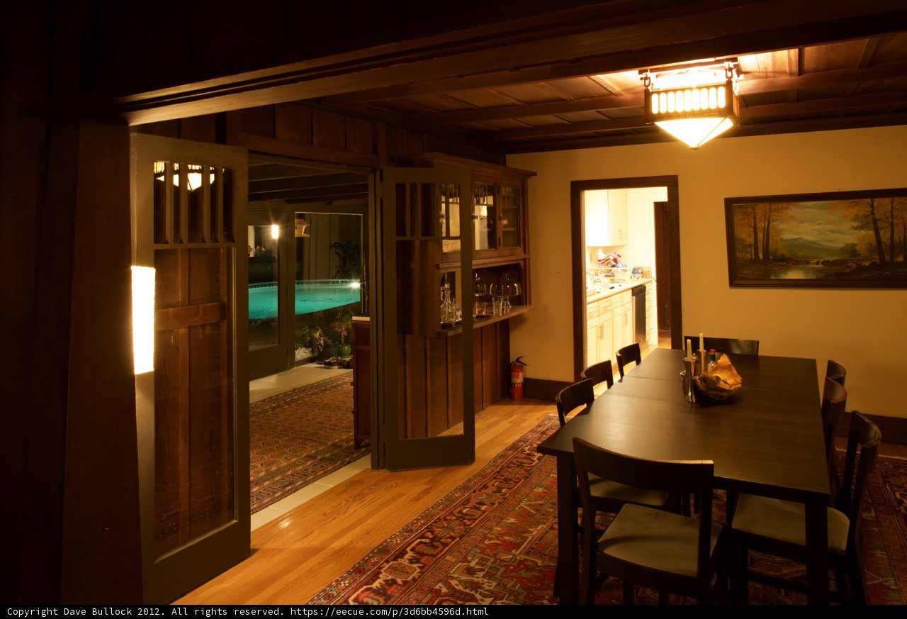 Cozy Dining Room with Art and Hardwood Flooring