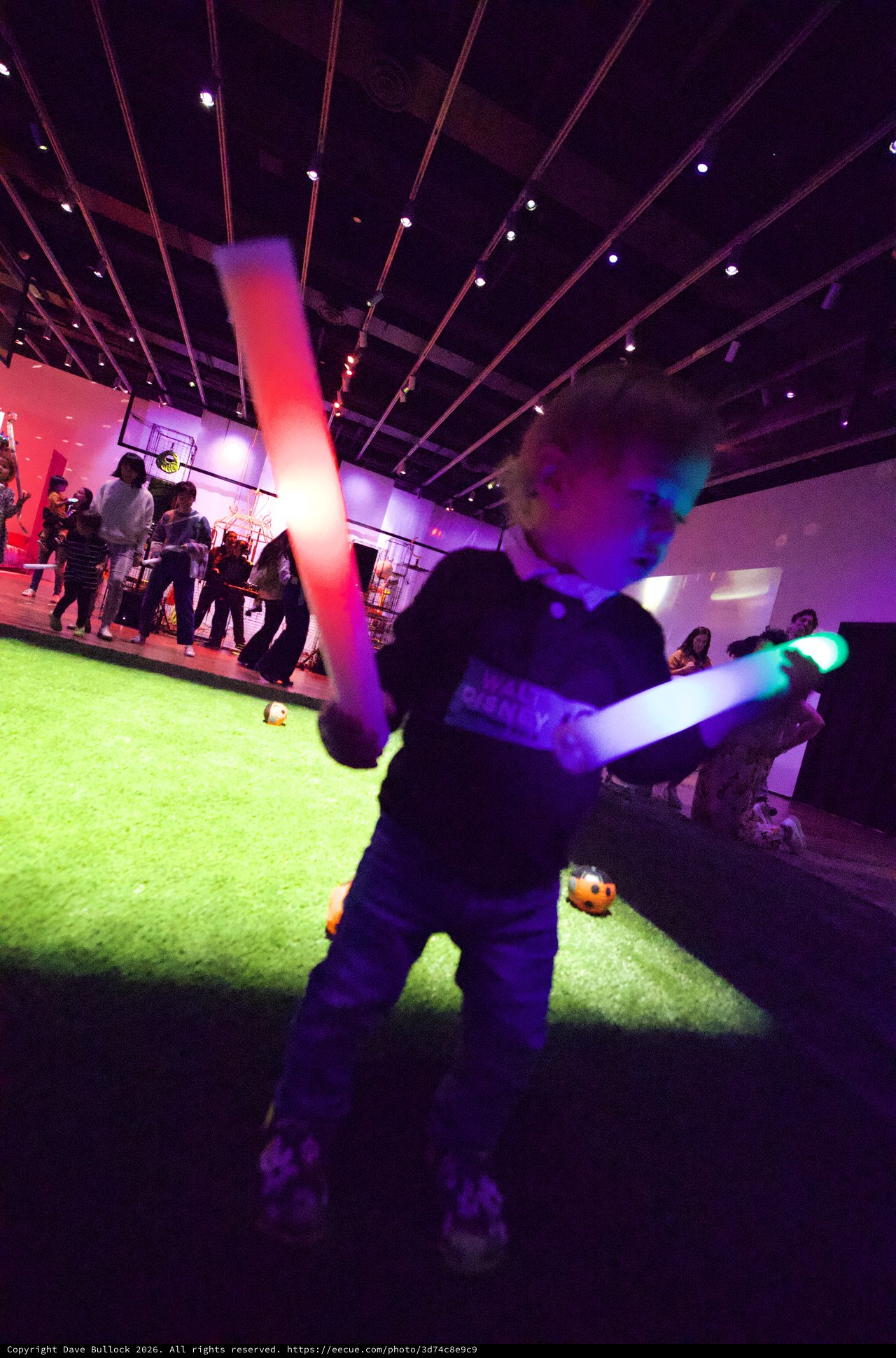 Child with Glowing Lightsaber at Baby Rave Event