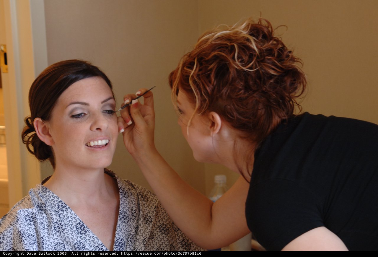 Bridal Makeup Artist Applies Final Touches Before Wedding