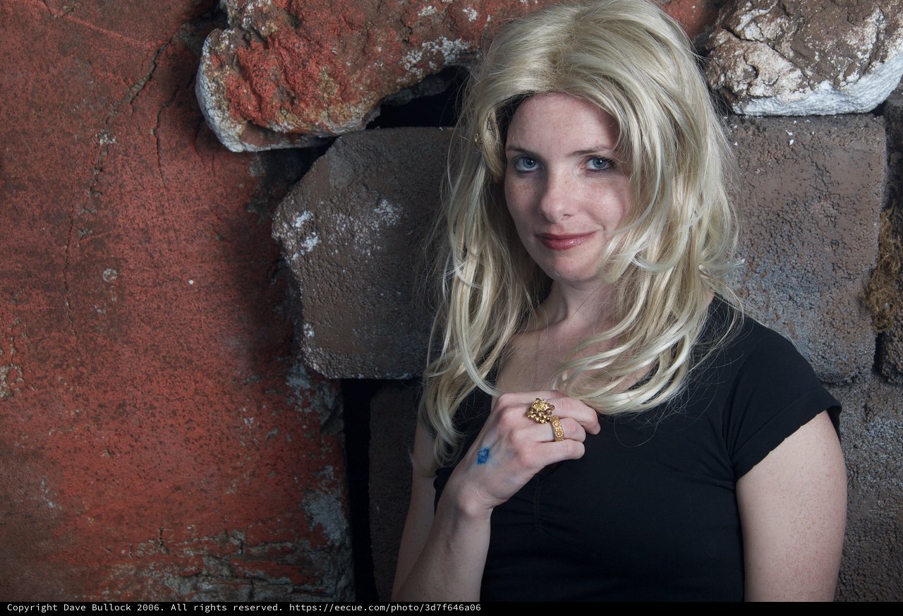 Blonde Halloween Costume Portrait Against Stone Wall