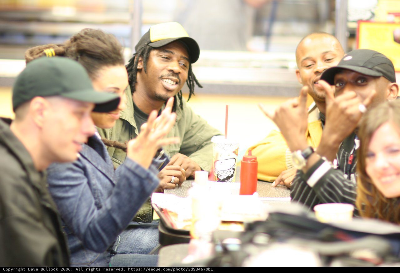 Friends Laughing Together at Fast Food Restaurant