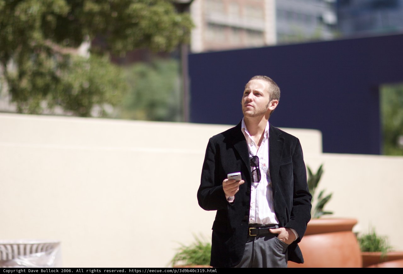 Stylish Businessman among Decorative Plants