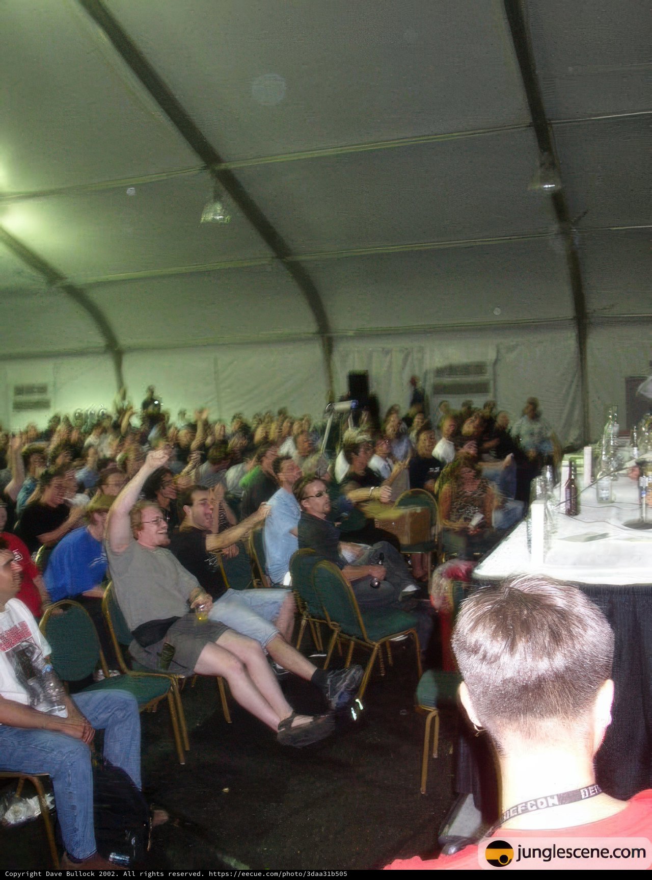 Speaker Addressing a Packed Tent