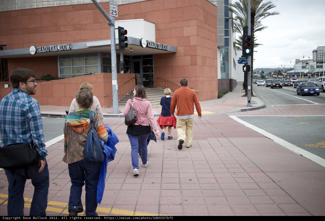 Family Strolling Past Chado Tea Room Downtown