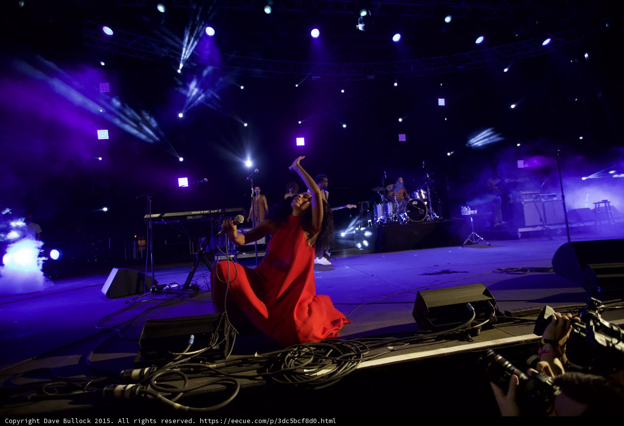 Solange Kneeling Arm Raised High Red Dress Dynamic