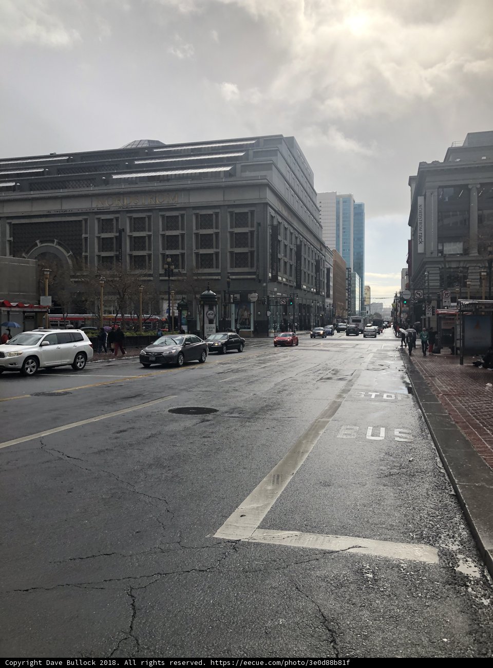 Urban Intersection with Parked Cars and Office Building
